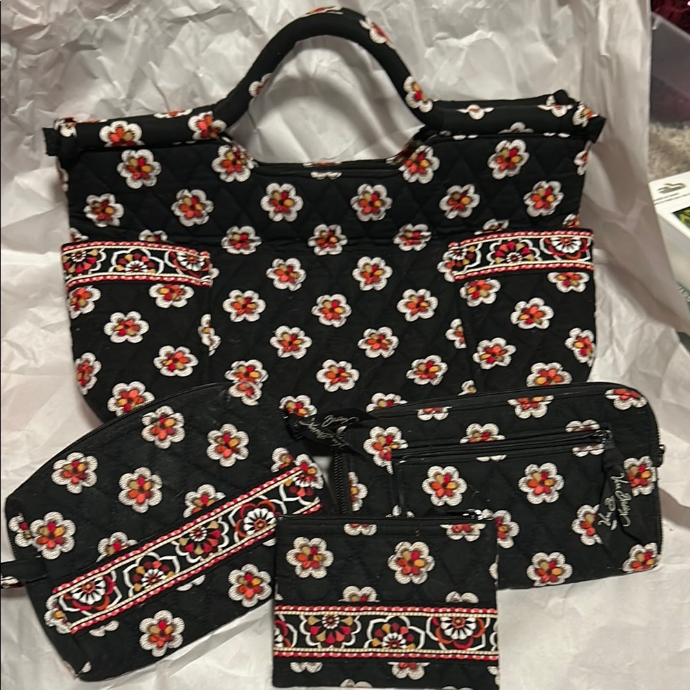 Vera Bradley set includes bag, wallet, cosmetic bag and small bag